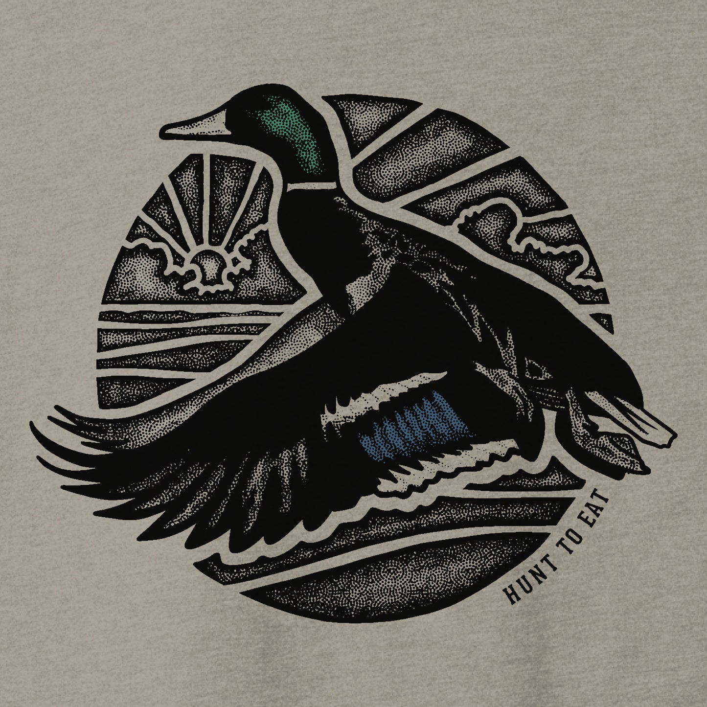 A gREY t-shirt addorned with a beeautiful male mallard duck flying in front of a monochrome sunrise. a duck hunters dream