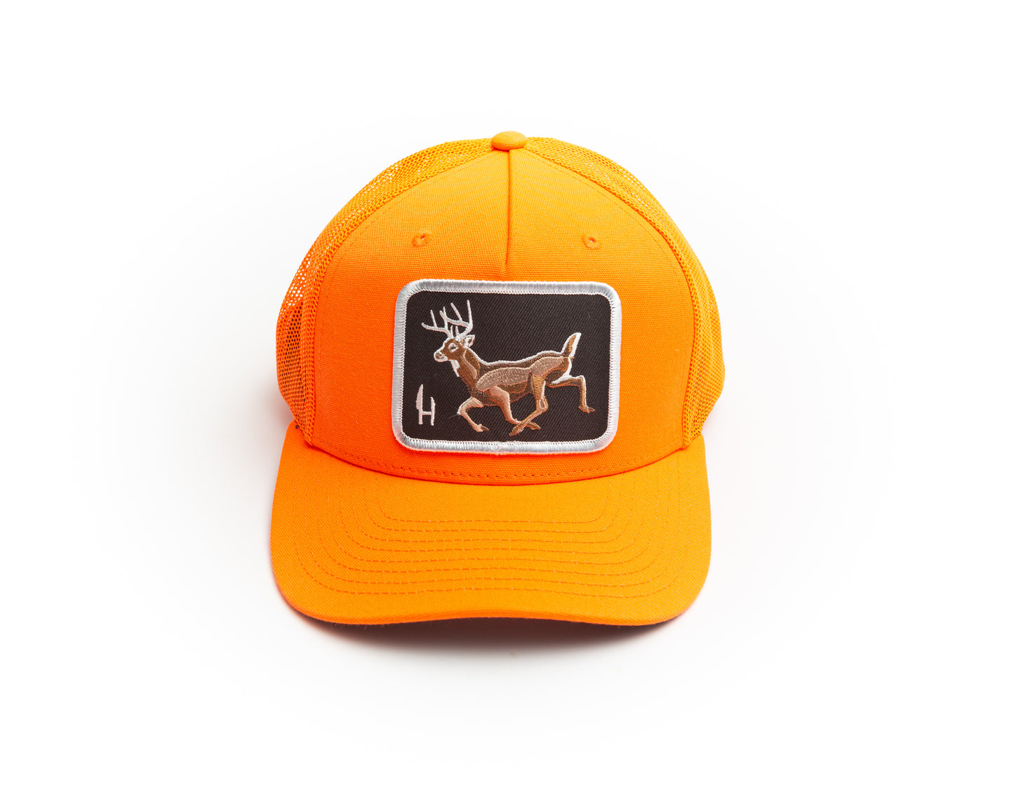 Safety Orange mesh backed trucker cap. baseball hat. snap back. This blaze orange trucker cap is decorated with an embroidered patch featuring a running whitetail deer buck. The eight point buck is embroidered on a black twill background and is surrounded by a white merrowed border. This is the perfect hat to wear in the woods during whitetail deer hunting gun season to keep you safe and visible.