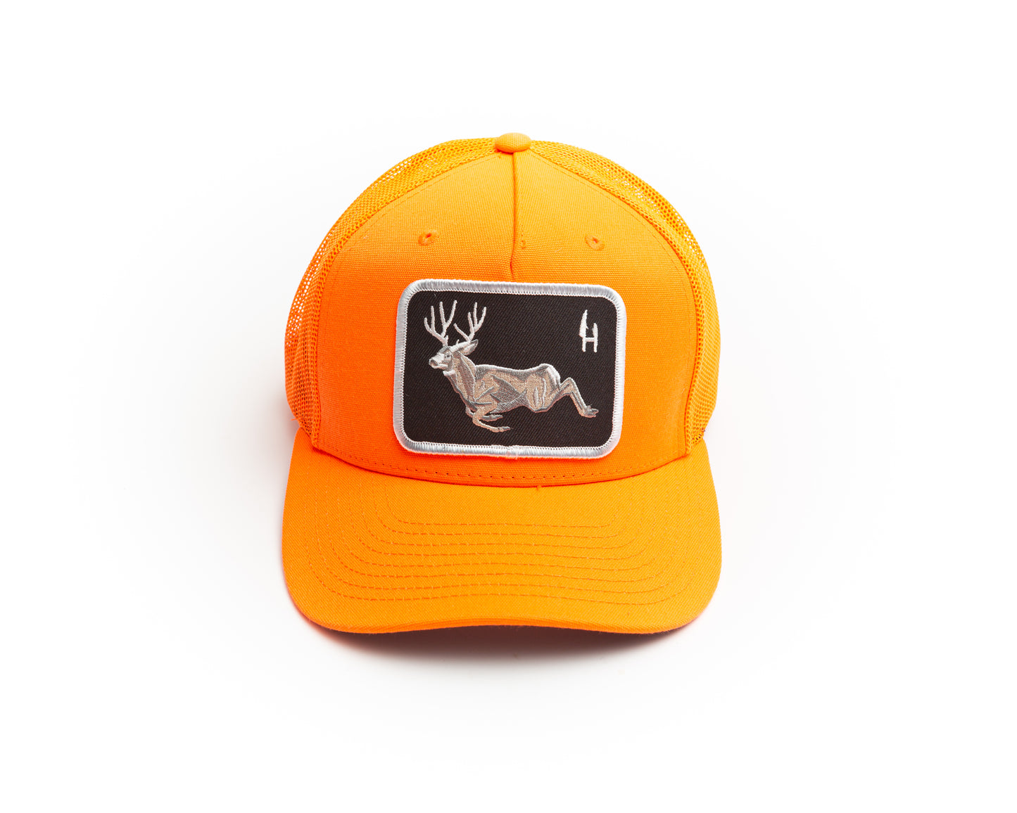Hunt To Eat blaze orange trucker cap decorated with a beautiful embroidered patch of a bounding Mule deer buck. The patch has a black twill background with white merrowed border. The hat is a richardson blaze orange trucker mesh snap back. Perfect for use during gun season, safety orange.